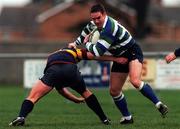 27 November 1999; Finbar Hayes of Suttonians RFC is tackled by Simon Cooney  of Banbridge RFC during the AIB All-Ireland League Division 4 match between Suttonians RFC and Banbridge RFC at the McDowell Grounds in Sutton, Dublin. Photo by Matt Browne/Sportsfile