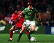 13 November 1999; Kevin Kilbane of Republic of Ireland in action against Tayfun Korkut of Turkey during the UEFA European Championships Qualifier Play-Off First Leg match between Republic of Ireland and Turkey at Lansdowne Road in Dublin. Photo by David Maher/Sportsfile