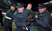 15 Feburary 1995; An England supporter is restrained by Gardai after rioting in the West Stand forced the abandonment of the international friendly match between Republic of Ireland and England at Lansdowne Road in Dublin. Photo by David Maher/Sportsfile