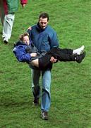 15 Feburary 1995; A young child is carried to safety after rioting broke out in the Upper West Stand forcing the abandonment of the international friendly match between Republic of Ireland and England at Lansdowne Road in Dublin. Photo by Ray McManus/Sportsfile