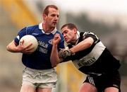 7 November 1999; Liam Hassett of Laune Rangers in action against Kieran Burns of Doonbeg during the AIB Munster Senior Club Football Championship semi-final match between Doonbeg and Laune Rangers at Fitzgerald Stadium in Killarney, Kerry. Photo by Ray Lohan/Sportsfile