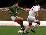 21 July 1999; Liam Miller of Republic of Ireland in action against Ediki Sajaia of Georgiaduring the Under 18 Championship Group B Round 2 between Georgia and Republic of Ireland at the Folkungavallen Stadium in Linköping, Sweden. Photo by David Maher/Sportsfile