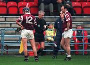 14 November 1999; Ollie Baker watches on as referee Pat Moore sends off St. Joseph's Doora Barefield captain Lorcan Hassett, 12, during the AIB Munster Senior Club Hurling Championship Final match between St. Joseph's Doora Barefield and Toomevara at Semple Stadium in Thurles, Tipperary. Photo by Ray McManus/Sportsfile