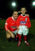 12 November 1999; Stephen Geoghegan of Shelbourne with 5 year old mascot Tadhg O'Mahoney, from Clontarf, Dublin, ahead of the Eircom League Premier Division match between Shelbourne and Bohemians at Tolka Park in Dublin. Photo by David Maher/Sportsfile