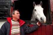 9 December 1999; Trainer Pat Rooney with Casper during a feature at Jordanstown Stables in Naul, Dublin. Photo by David Maher/Sportsfile
