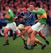 28 November 1999; Aodán Mac Gearailt of Kerry in action against Peadar Andrews of Dublin during the Church & General National Football League match between Dublin and Kerry at Parnell Park in Dublin. Photo by Aoife Rice/Sportsfile