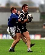 7 November 1999; Senan Hehir of Doonbeg is tackled by Brendan Fitzgerald of Laune Rangers during the AIB Munster Senior Club Football Championship semi-final match between Doonbeg and Laune Rangers at Fitzgerald Stadium in Killarney, Kerry. Photo by Ray Lohan/Sportsfile