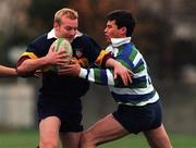 27 November 1999; Simon Cahill of Banbridge RFC is tackled by David Jones of Suttonians RFC during the AIB All-Ireland League Division 4 match between Suttonians RFC and Banbridge RFC at the McDowell Grounds in Sutton, Dublin. Photo by Matt Browne/Sportsfile