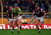 14 November 1999; Terry Dunne of Toomevara in action against Ollie Baker, left, and Joe Considine of St. Joseph's Doora Barefield during the AIB Munster Senior Club Hurling Championship Final match between St. Joseph's Doora Barefield and Toomevara at Semple Stadium in Thurles, Tipperary. Photo by Ray McManus/Sportsfile