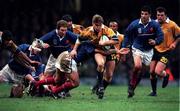 6 November 1999; Tim Horan of Australia is tackled by Raphael Ibanez of France during the Rugby World Cup Final match between Australia and France at the Millenium Stadium in Cardiff, Wales. Photo by Brendan Moran/Sportsfile