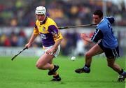 30 May 1999; Tom Dempsey of Wexford in action against John Finnegan of Dublin during the Guinness Leinster Senior Hurling Championship Quarter-Final match between Dublin and Wexford at Nowlan Park in Kilkenny. Photo by Aoife Rice/Sportsfile