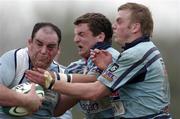 14 April 2007; John Staunton, Garryowen, is tackled by Niall Conlon and Ben Hanvey, left, Belfast Harlequins. AIB Senior Cup Final, Garryowen v Belfast Harlequins, Dubarry Park, Athlone, Co. Westmeath. Picture credit; Matt Browne / SPORTSFILE