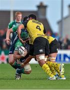 18 October 2014; Aly Muldowney, Connacht, is tackled by Benoit Guyot, centre, and Romana Graham, La Rochelles. European Rugby Challenge Cup 2014/15, Pool 2, Round 1, Connacht v La Rochelle, The Sportsground, Galway. Picture credit: Barry Cregg / SPORTSFILE
