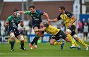 18 October 2014; Robbie Henshaw, Connacht, with support from team-mate John Muldoon, is tackled by Arthur Cestaro, centre, and Nicolas Djebaili, La Rochelles. European Rugby Challenge Cup 2014/15, Pool 2, Round 1, Connacht v La Rochelle, The Sportsground, Galway. Picture credit: Barry Cregg / SPORTSFILE