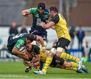 18 October 2014; Robbie Henshaw, Connacht, with support from team-mate John Muldoon, is tackled by Arthur Cestaro, centre, and Nicolas Djebaili, La Rochelles. European Rugby Challenge Cup 2014/15, Pool 2, Round 1, Connacht v La Rochelle, The Sportsground, Galway. Picture credit: Barry Cregg / SPORTSFILE