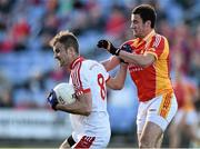 19 October 2014; Jaons Gibbons, Ballintubber, in action against Niall Lydon, Castlebar Mitchels. Mayo County Senior Football Championship Final, Castlebar Mitchels v Ballintubber, MacHale Park, Castlebar, Co. Mayo. Picture credit: David Maher / SPORTSFILE