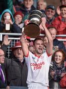 19 October 2014; Ballintubber captain Jason Gibbons, celebrates at then end of the game lifting the MoClair Cup. Mayo County Senior Football Championship Final, Castlebar Mitchels v Ballintubber, MacHale Park, Castlebar, Co. Mayo. Picture credit: David Maher / SPORTSFILE