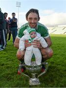 19 October 2014; Kilmallock's Paudie O'Brien celebrates after the game with his four-month-old daughter Fiadh O'Brien. Limerick County Senior Hurling Championship Final, Na Piarsaigh v Kilmallock, Gaelic Grounds, Limerick. Picture credit: Diarmuid Greene / SPORTSFILE