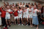 19 October 2014; Ballintubber players celebrate at the end of the game in their dressing room. Mayo County Senior Football Championship Final, Castlebar Mitchels v Ballintubber, MacHale Park, Castlebar, Co. Mayo. Picture credit: David Maher / SPORTSFILE