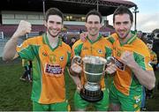 19 October 2014; Corofin Brothers Martin, Michael and James with the Frank Fox cup after the game. Galway County Senior Football Championship Final, Corofin v St Michael's, Tuam Stadium, Tuam, Co. Galway. Picture credit: Ray Ryan / SPORTSFILE