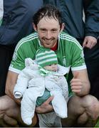 19 October 2014; Kilmallock's Paudie O'Brien celebrates after the game with his daughter Fiadh O'Brien, four months old. Limerick County Senior Hurling Championship Final, Na Piarsaigh v Kilmallock, Gaelic Grounds, Limerick. Picture credit: Diarmuid Greene / SPORTSFILE