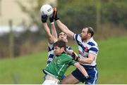 19 October 2014; Conor Carey, Donaghmore/Ashbourne, in action against Cormac McGuinness, left, and Gary O'Brien, Navan O'Mahonys. Meath County Senior Football Championship Final, Navan O'Mahonys v Donaghmore/Ashbourne, Páirc Tailteann, Navan, Co. Meath. Picture credit: Ramsey Cardy / SPORTSFILE