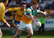 15 April 2007; Neville Coughlan, Offaly, in action against Anthony McDermott, Roscommon. Allianz National Football League, Division 2A, Offaly v Roscommon, O'Connor Park, Tullamore, Co. Offaly. Picture credit; Brian Lawless / SPORTSFILE