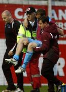 17 April 2007; Drogheda United's Aidan O'Keefe is carried off the pitch injured during the game. Setanta Cup Group 1, Drogheda United v Derry City, United Park, Drogheda, Co. Louth. Picture credit; David Maher / SPORTSFILE