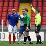 21 April 2007; Referee Damien Hancock gives Paul McAreavey, Linfield, a red card late in the game. Carnegie Premier League, Linfield v Glenavon, Windsor Park, Belfast, Co. Antrim. Picture credit; Oliver McVeigh / SPORTSFILE