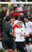 21 April 2007; Jason Hill, Glentoran, is shown a yellow card from referee Adrian McCourt. Carnegie Premier League, Cliftonville v Glentoran, Solitude, Belfast, Co. Antrim. Picture credit; Russell Pritchard / SPORTSFILE
