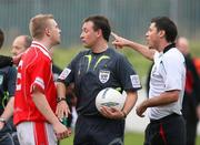 21 April 2007; Referee Adrian McCourt stands between Cliftonville's David McAlinden and Glentoran's Dean Fitzgerald during a dispute after the final whistle. Carnegie Premier League, Cliftonville v Glentoran, Solitude, Belfast, Co. Antrim. Picture credit; Russell Pritchard / SPORTSFILE