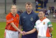 21 April 2007; Referee Joe Murray oversees Juliet Murphy, Cork, and Mayo's Chris Heffernan shake hands before the game. Suzuki Ladies National Football League Division 1 Semi-Final, Cork v Mayo, Banagher, Co. Offaly. Picture credit; Matt Browne / SPORTSFILE
