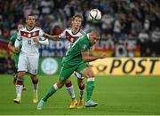 14 October 2014; Jon Walters, Republic of Ireland, in action against Lukas Podolski, left, and Erik Durm, Germany. UEFA EURO 2016 Championship Qualifer, Group D, Germany v Republic of Ireland, Veltins Stadium, Gelsenkirchen, Germany. Picture credit: Pat Murphy / SPORTSFILE