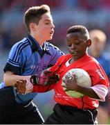 23 October 2014; Belguy Manzambi, St. Patrick's SNS, Corduff, in action against Conor Moriarty, St. Mary's BNS, Booterstown, during the Sciath Clanna Gael Final. Allianz Cumann na mBunscol Finals, Croke Park, Dublin. Picture credit: Pat Murphy / SPORTSFILE