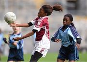 23 October 2014; Henrietta Igbinomwanhia, St. Luke's NS, Tyrrelstown, in action against Tomi Onasoga, St Mary's NS, Garristown, during the Corn Na Laoch Final. Allianz Cumann na mBunscol Finals, Croke Park, Dublin. Picture credit: Pat Murphy / SPORTSFILE