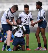 23 October 2014; Iminiu Tsalabiendze, St. Martin De Porres, Aylesbury, celebrates at the final whistle surrounded by team-mates, from left, Josh Hanley, Junior Ozhianvuna and Japhet Mbuenemo after winning the Corn Matt Griffin final. Allianz Cumann na mBunscol Finals, Croke Park, Dublin. Picture credit: Pat Murphy / SPORTSFILE