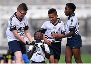 23 October 2014; Iminiu Tsalabiendze, St. Martin De Porres, Aylesbury, celebrates at the final whistle surrounded by team-mates, from left, Josh Hanley, Junior Ozhianvuna and Japhet Mbuenemo after winning the Corn Matt Griffin final. Allianz Cumann na mBunscol Finals, Croke Park, Dublin. Picture credit: Pat Murphy / SPORTSFILE