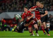 24 October 2014; Ian Keatley, Munster, offloads the ball as he is tackled by Billy Vunipola, left, and Owen Farrell, Saracens. European Rugby Champions Cup 2014/15, Pool 1, Round 2, Munster v Saracens, Thomond Park, Limerick. Pictuer credit: Diarmuid Greene / SPORTSFILE