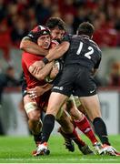 24 October 2014; Tommy O'Donnell, Munster, is tackled by Jim Hamilton, left, and Brad Barritt, Saracens. European Rugby Champions Cup 2014/15, Pool 1, Round 2, Munster v Saracens, Thomond Park, Limerick. Pictuer credit: Matt Browne / SPORTSFILE