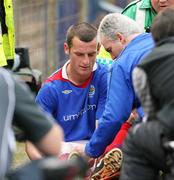 21 April 2007; Linfield's Oran Kearney talks to team Physio Terry Dickson, as he is stretchered off the field after injury with suspected Cruciate ligament damage. Carnegie Premier League, Linfield v Glenavon, Windsor Park, Belfast, Co. Antrim. Picture credit; Oliver McVeigh / SPORTSFILE
