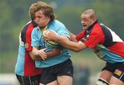 21 April 2007; Paul O'Donohoe, UCD, is tackled by Colin Atkinson, left, and Lewis Stevenson, Belfast Harlequins. AIB League Division One, UCD v Belfast Harlequins, Belfield Bowl, University College Dublin, Dublin. Picture credit: Ray McManus / SPORTSFILE