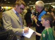 24 April 2007; Ireland's Niall O'Brien signs an autograph for Scott Murray, from Dublin, on the teams return from the ICC 2007 Cricket World Cup. Dublin Airport, Dublin. Picture credit: Pat Murphy / SPORTSFILE