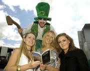 26 April 2007; Race fans from left Cathy Day, Tipperary, Fidelma Breathnach, Galway, and Nicola Byrne, Dublin, with entertainer Mick Eila at the Punchestown National Hunt Festival. Punchestown Racecourse, Co. Kildare. Picture credit: Pat Murphy / SPORTSFILE