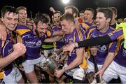 24 October 2014; Kilmacud Crokes players celebrate with the New Ireland Cup after the game. Dublin County Senior Hurling Championship Final, St Judes v Kilmacud Crokes, Parnell Park, Dublin. Picture credit: Pat Murphy / SPORTSFILE