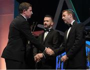 24 October 2014; Darren Gleeson, Tipperary, is congratulated on receiving his All-Star award by Dave Sheeran, right, Managing Director, Opel Ireland, during the 2014 GAA GPA All-Star Awards, sponsored by Opel. Convention Centre, Dublin. Picture credit: Brendan Moran / SPORTSFILE