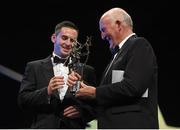 24 October 2014; Cathal Barrett, Tipperary, is presented with the GAA GPA Young Hurler of the Year award by Eddie Keher during the 2014 GAA GPA All-Star Awards, sponsored by Opel. Convention Centre, Dublin.  Picture credit: Brendan Moran / SPORTSFILE