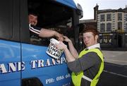 27 April 2007; Terenure College transition year student Rob Lynam collects a donation from truck driver Ger Kane, from Summerhill, Co. Meath, at Rathfarnham Road, Terenure, during the Special Olympics &quot;Road to China&quot; Collection Day, the aim of which is to provide more opportunities for people with a learning difficulty in their own communities and to help prepare Team Ireland for the 2007 World Games in China in October. Picture credit: Ray McManus / SPORTSFILE