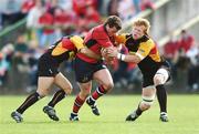 28 April 2007; Ian Dowling, Munster, is tackled by Philip Dollman, left, and Jamie Ringer, Newport Gwent Dragons. Magners League, Munster v Newport Gwent Dragons, Musgrave Park, Cork. Picture credit: Brendan Moran / SPORTSFILE