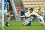 29 April 2007; Jason Phelan, Laois, takes a shot despite the attentions of Wicklow goalkeeper Tom Finn and full back Graham Keogh. Allianz National Hurling League, Division 2 Final, Wicklow v Laois, Semple Stadium, Thurles, Co. Tipperary. Picture credit: Brendan Moran / SPORTSFILE