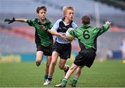 23 October 2014; Hugo McWade, St. Michael's, Ballsbridge, in action against Stephen Grogan, 6, and Ruairi Hogan, left, St. Joseph's, Terenure, during the Scaith na nGearaltach final. Allianz Cumann na mBunscol Finals, Croke Park, Dublin. Picture credit: Pat Murphy / SPORTSFILE